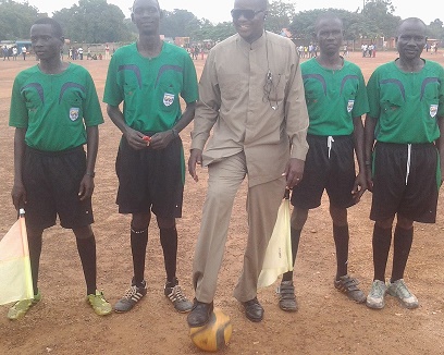 John James Wani centre with referees at Yei Freedom square play ground in November this year